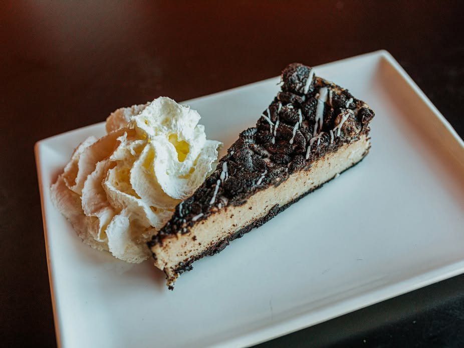 Cookies-and-cream cheesecake with whipped cream
