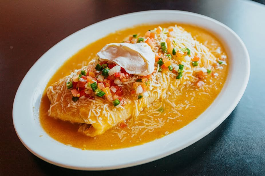 Smothered burrito with cheese, pico, and sour cream