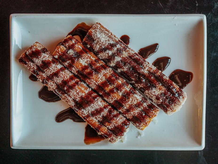 Sugar churros with chocolate drizzle