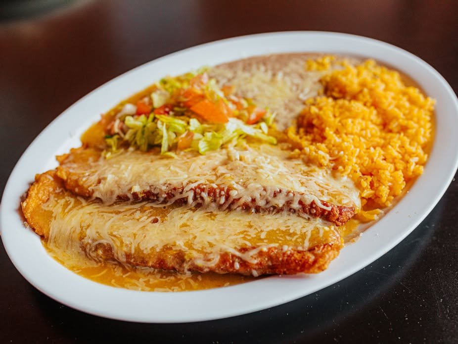 Cheese enchiladas with rice, beans, and salad